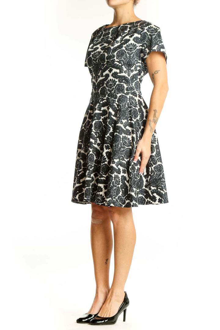 Front view of Closet London black and white floral print fit and flare dress