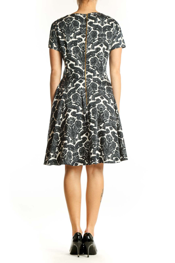 Side view of Closet London black and white floral print fit and flare dress