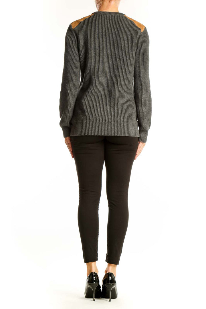 Side view of model wearing J.Crew gray ribbed cotton sweater with suede patches