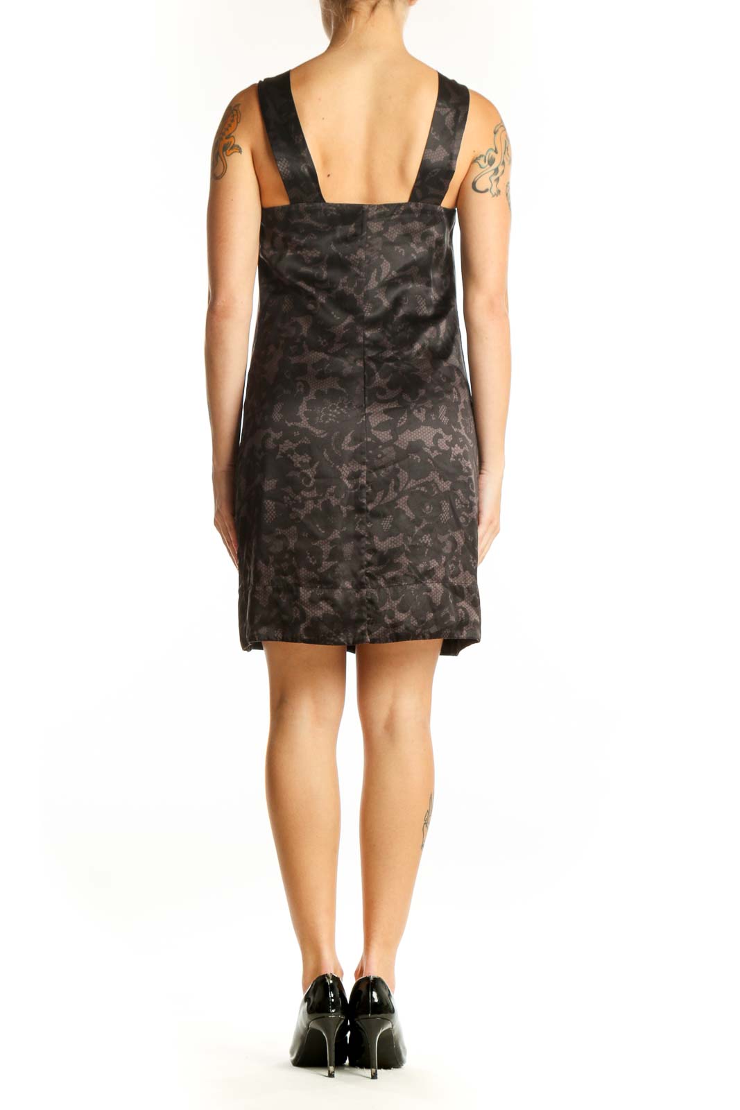 Side view of Banana Republic black floral cocktail dress showing flowing silhouette