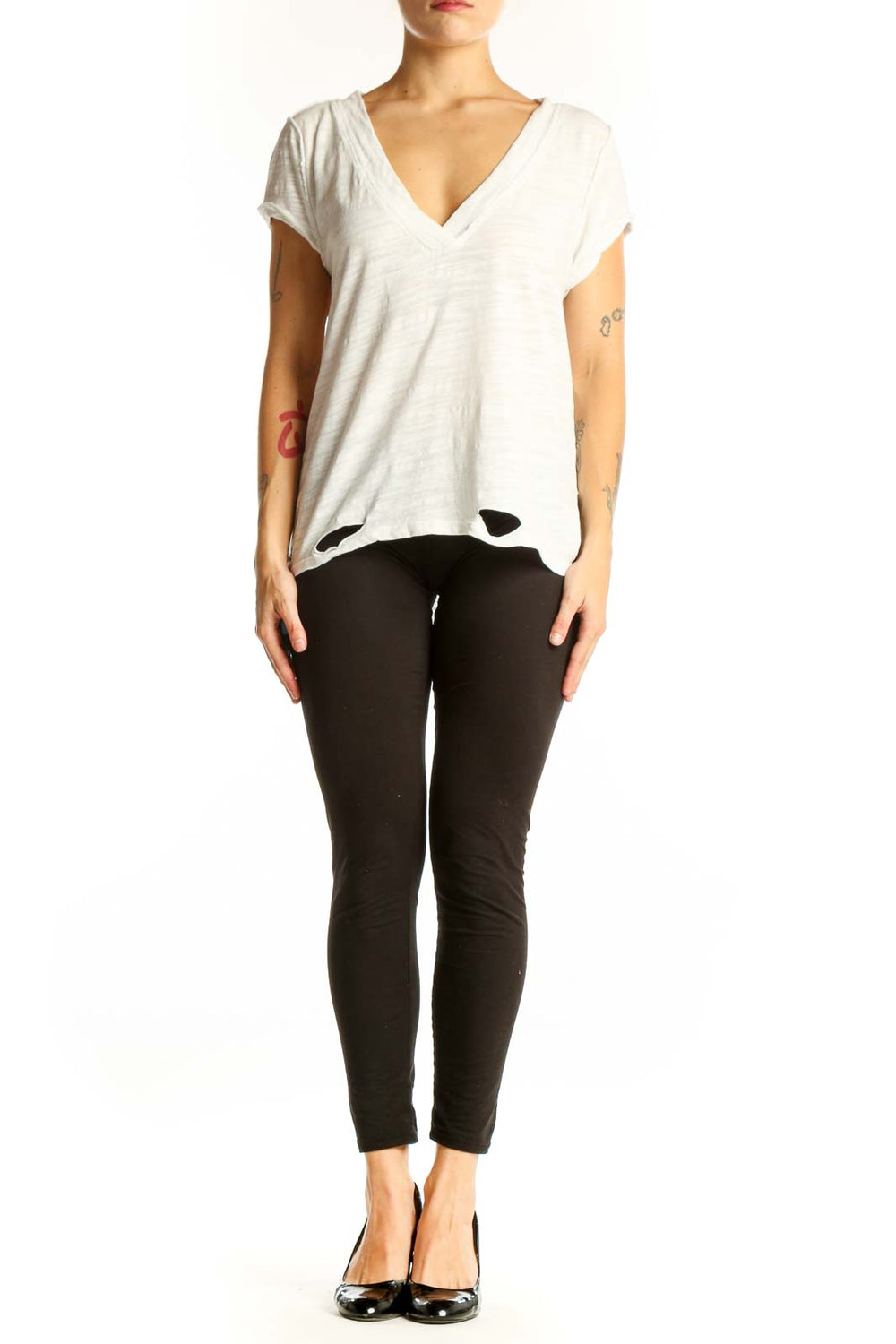 Front view of WE THE FREE white V-neck distressed top