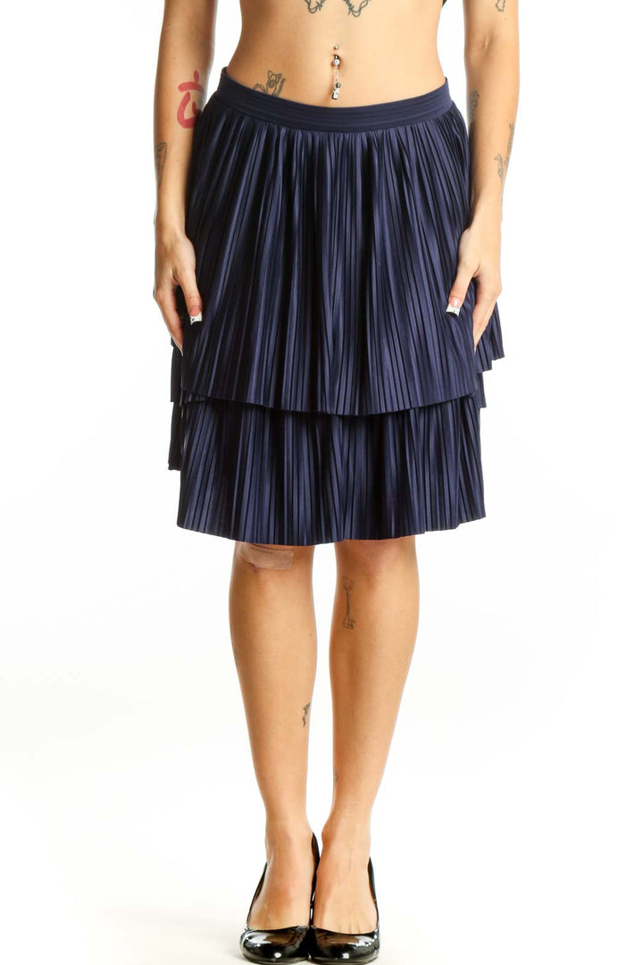 Front view of navy pleated tiered skirt from Banana Republic