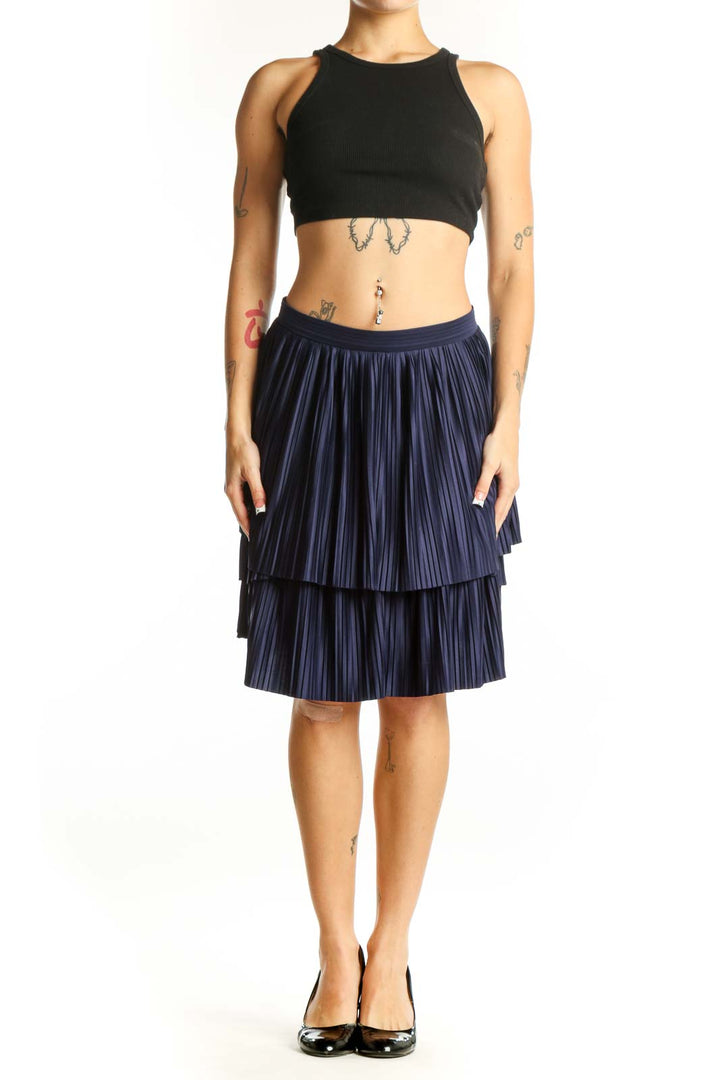 Front view of navy pleated tiered skirt from Banana Republic