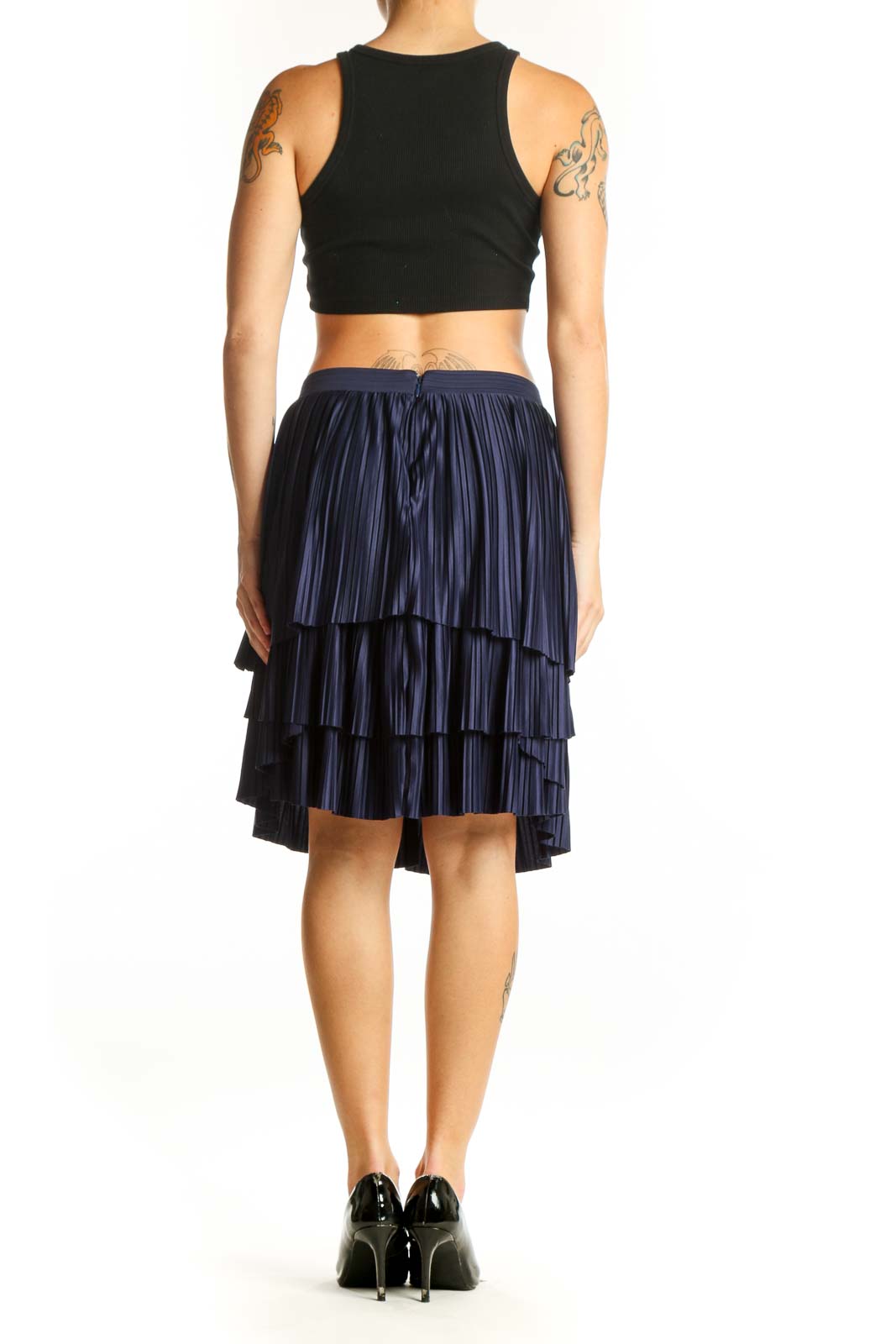 Side view of navy pleated tiered skirt with black top