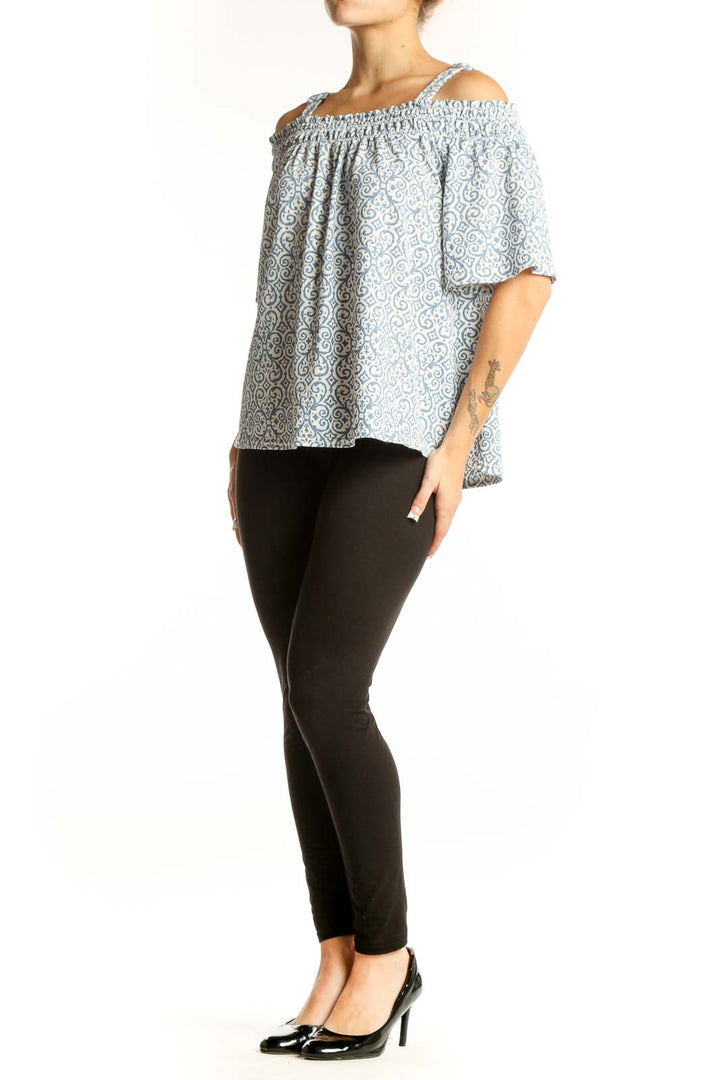 Front view of Melloday blue and white floral off-shoulder top with adjustable straps
