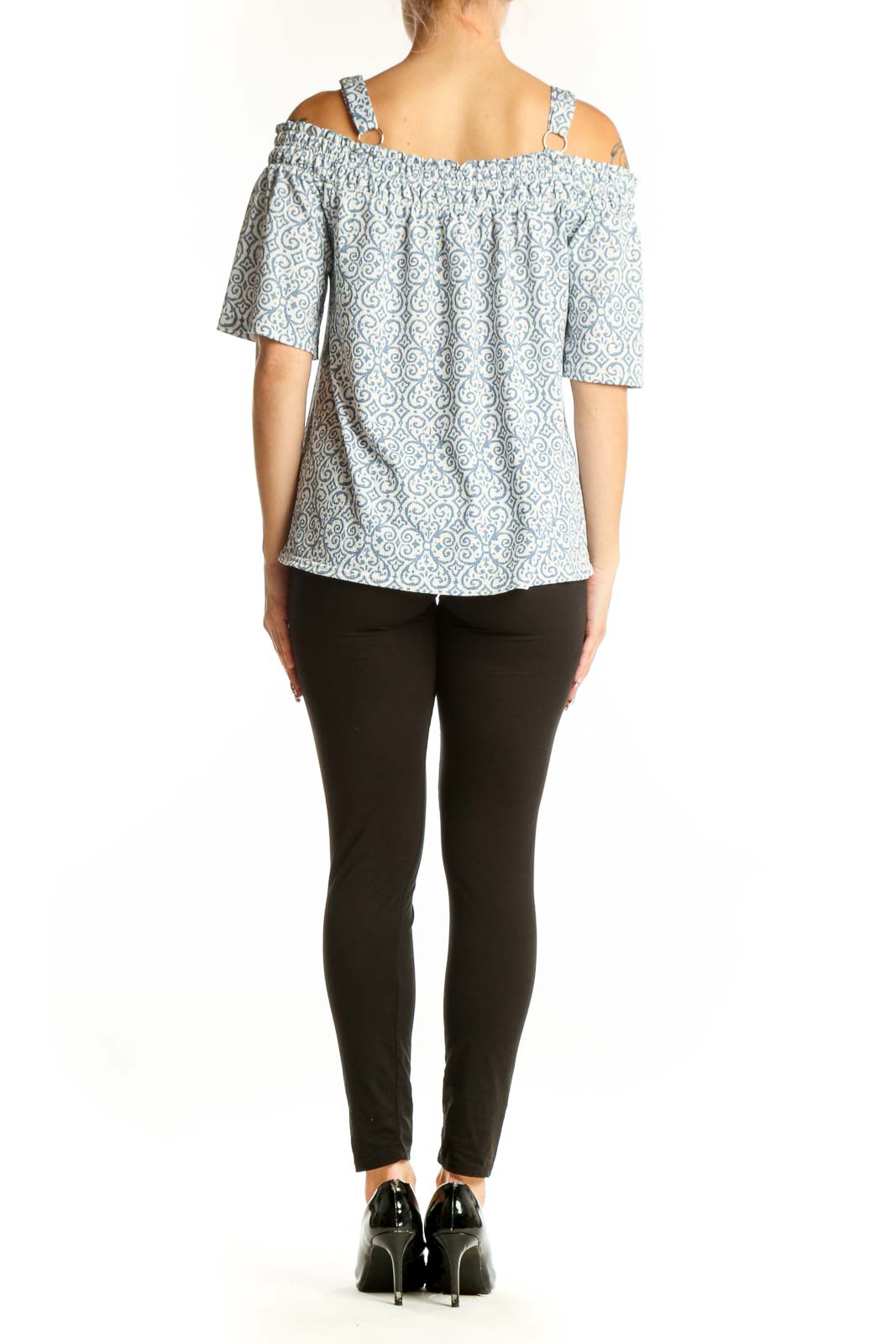 Side view of model wearing Melloday blue and white floral off-shoulder top
