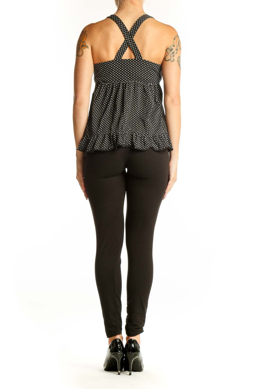 Side view of J.Crew black polka dot cotton halter top showing ruffle hem