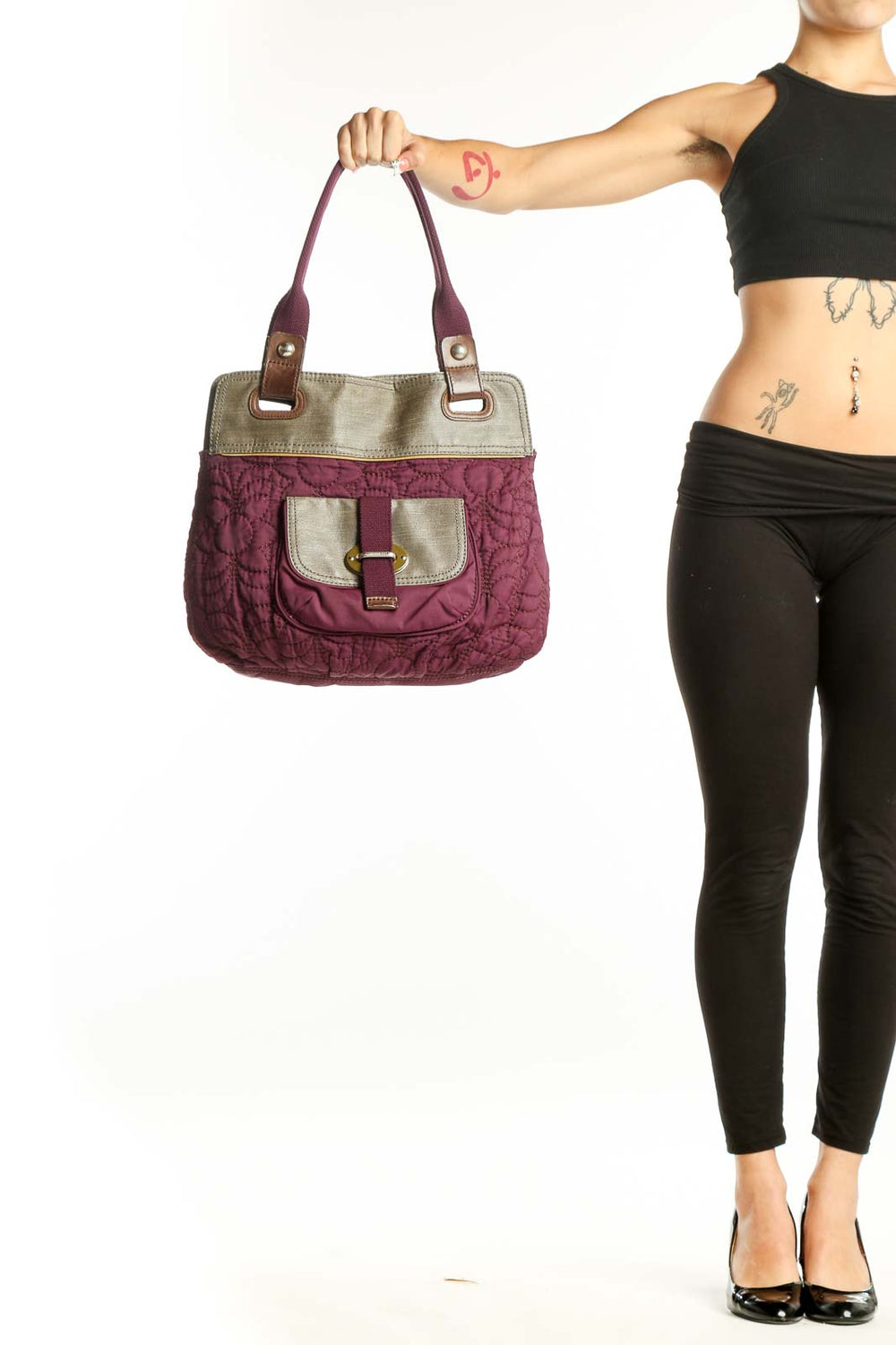 Front view of purple quilted Fossil messenger bag with beige trim