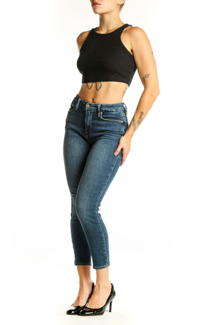 Front view of Good American blue cropped skinny jeans on model