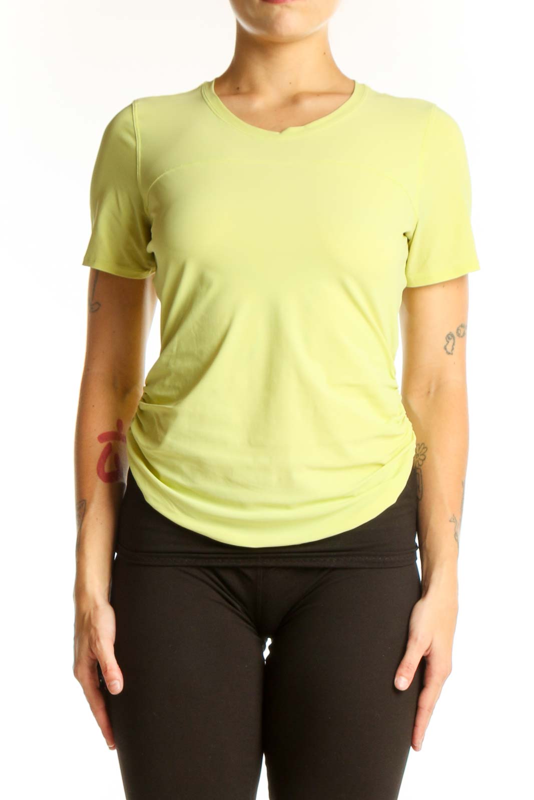 Front view of yellow Lululemon short-sleeve athletic top