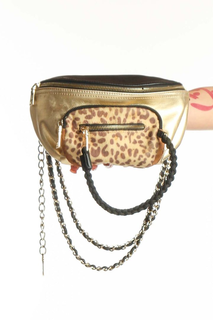 Front view of Steve Madden gold and leopard print crossbody bag with chain strap