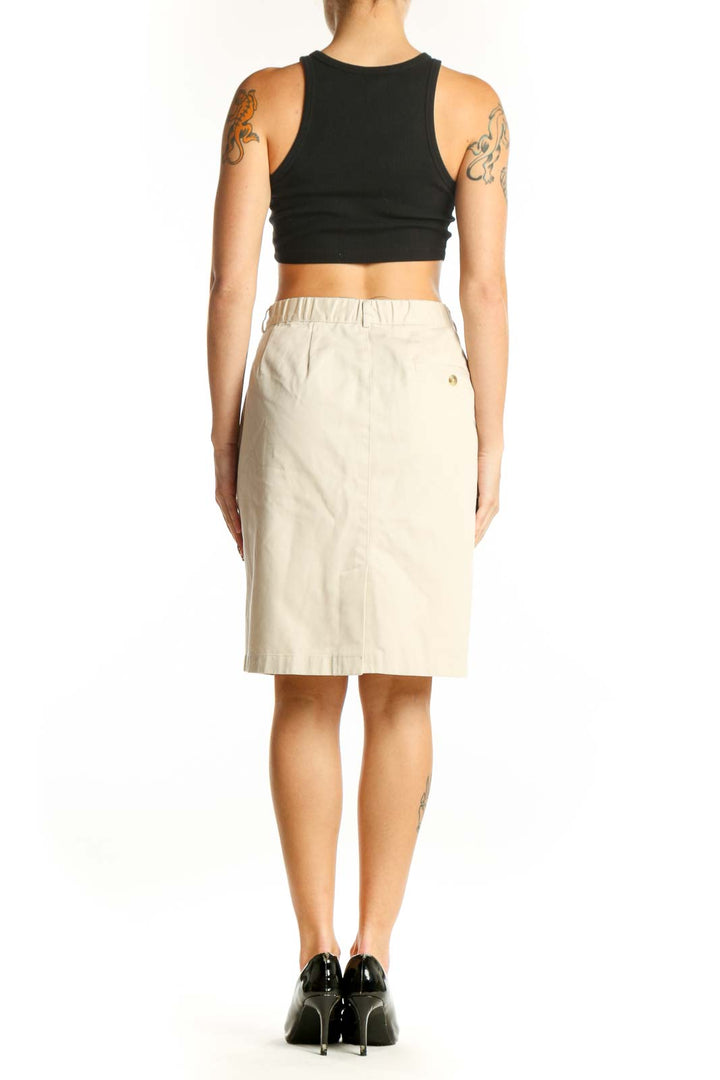 Side view of L.L.Bean beige cotton knee-length pencil skirt on model