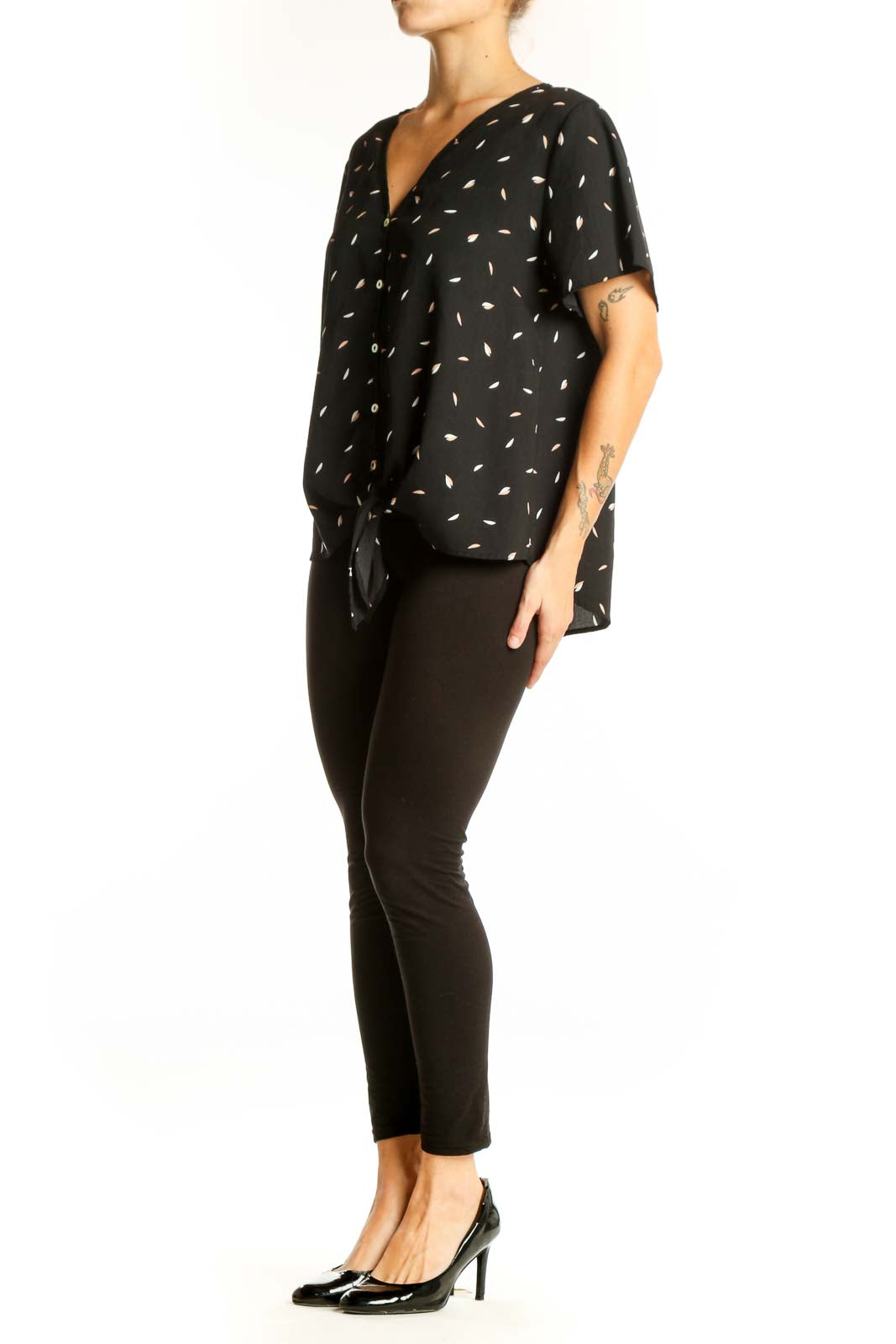 Front view of West Kei black blouse with white leaf pattern and tie-front detail