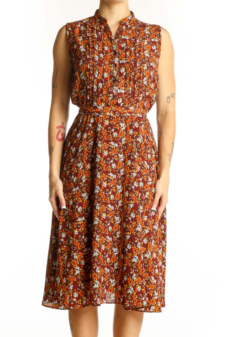 Front view of Nanette Lepore orange floral sleeveless midi dress