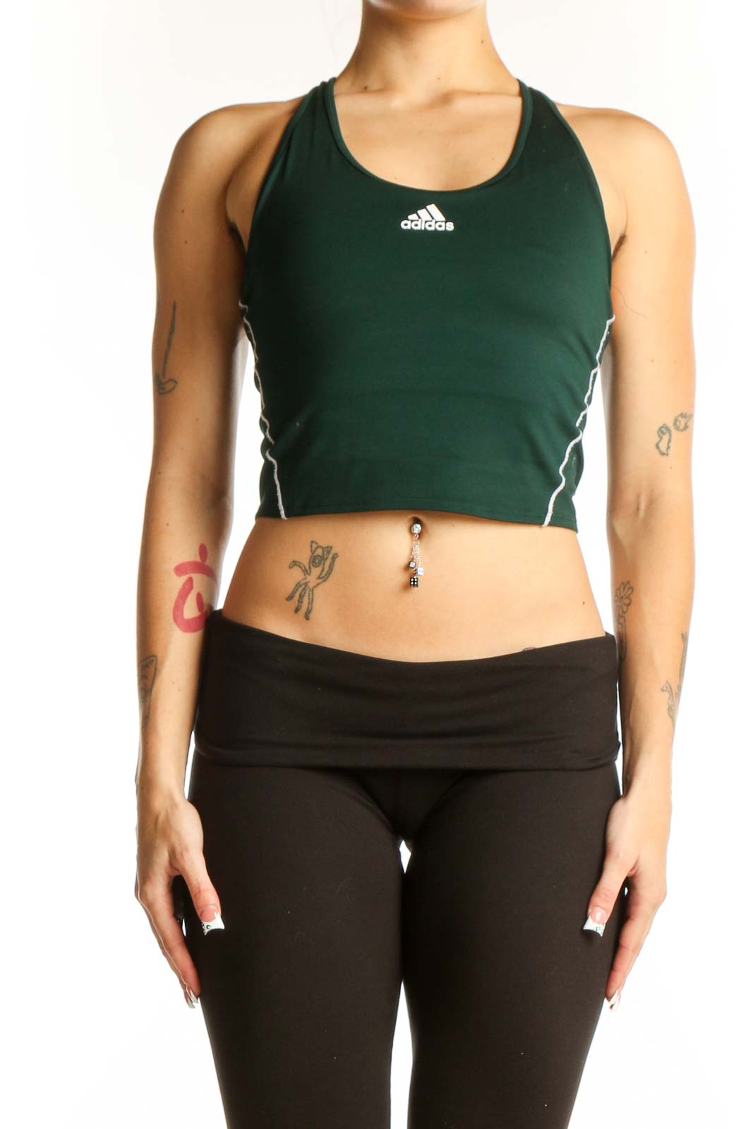 Front view of green Adidas racerback crop top on model