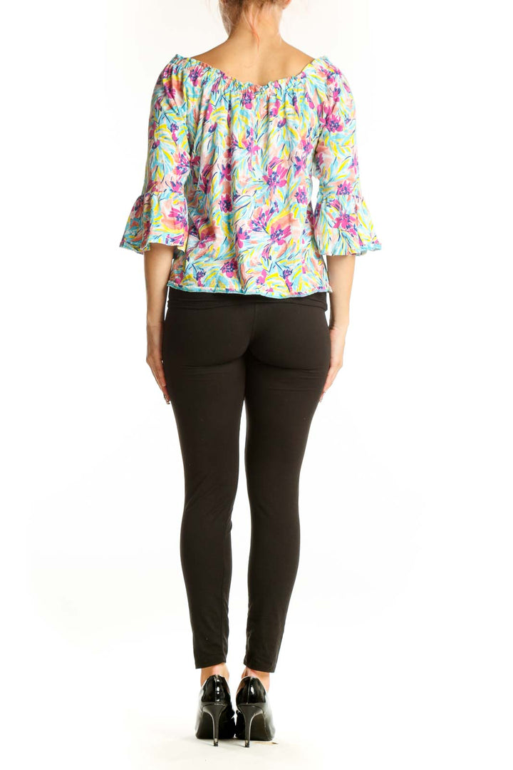 Back view of Stella Parker multicolor floral print off-shoulder top on model