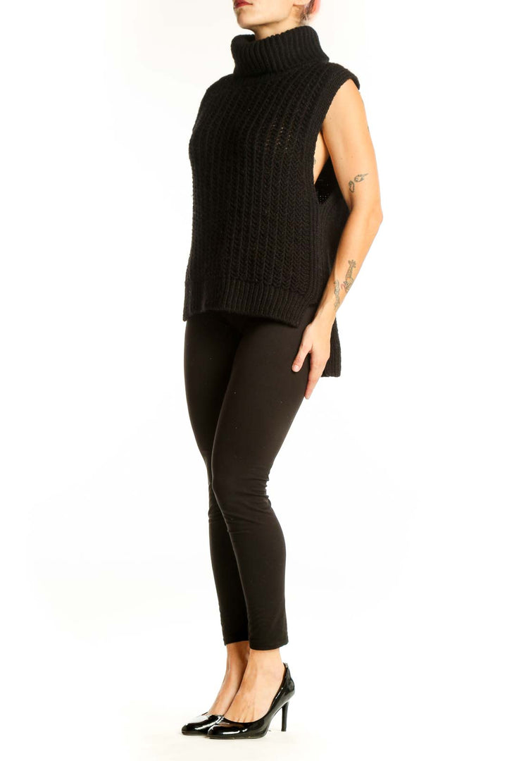 Front view of black sleeveless turtleneck sweater by SilkRoll