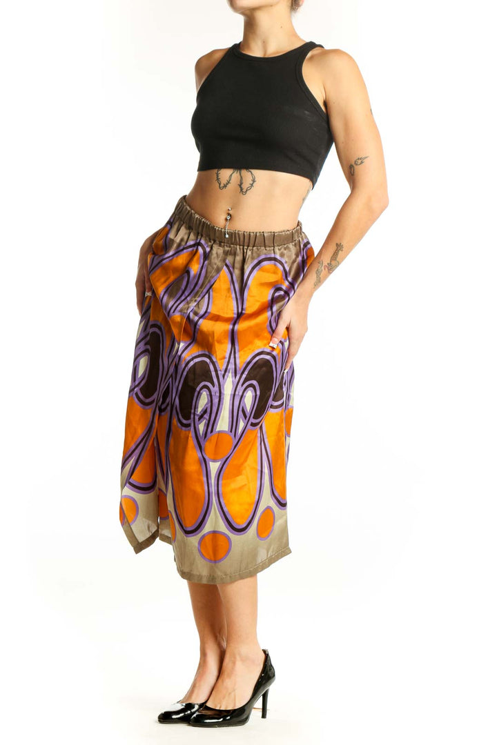 Front view of SilkRoll orange and purple abstract print silk midi skirt