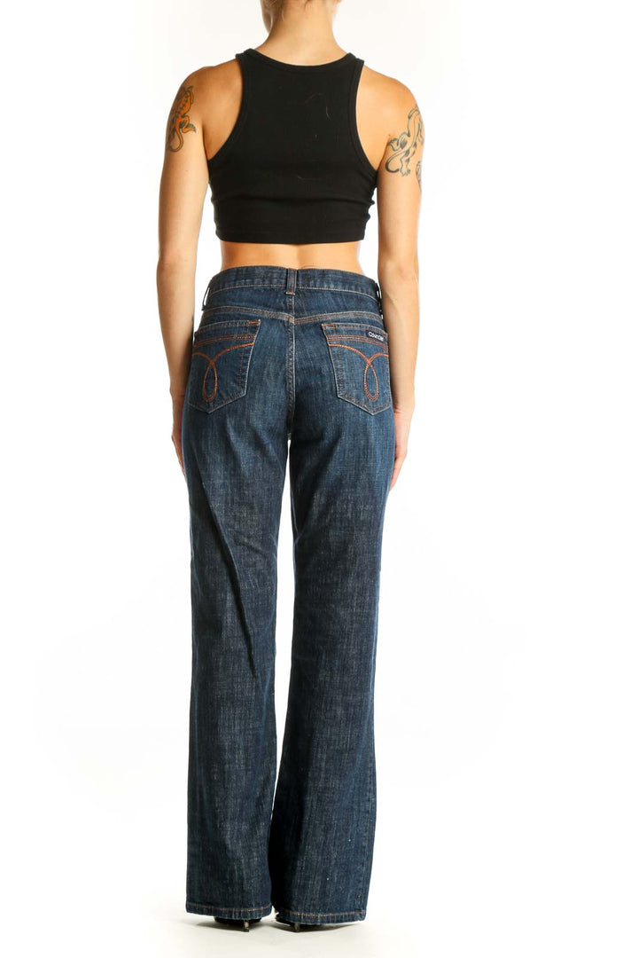 Back view of Calvin Klein dark blue wide-leg jeans on model