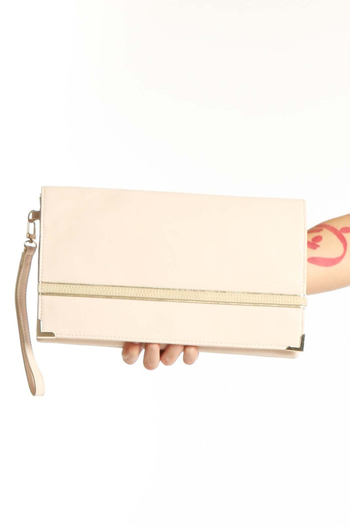 Cream fold-over clutch with gold metallic stripe detail and wrist strap by White House Black Market