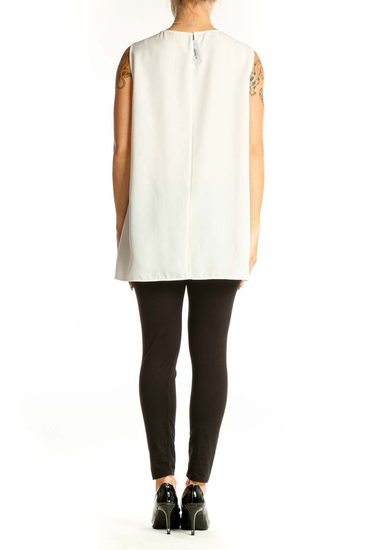 Side view of Lafayette 148 New York white layered sleeveless blouse on model