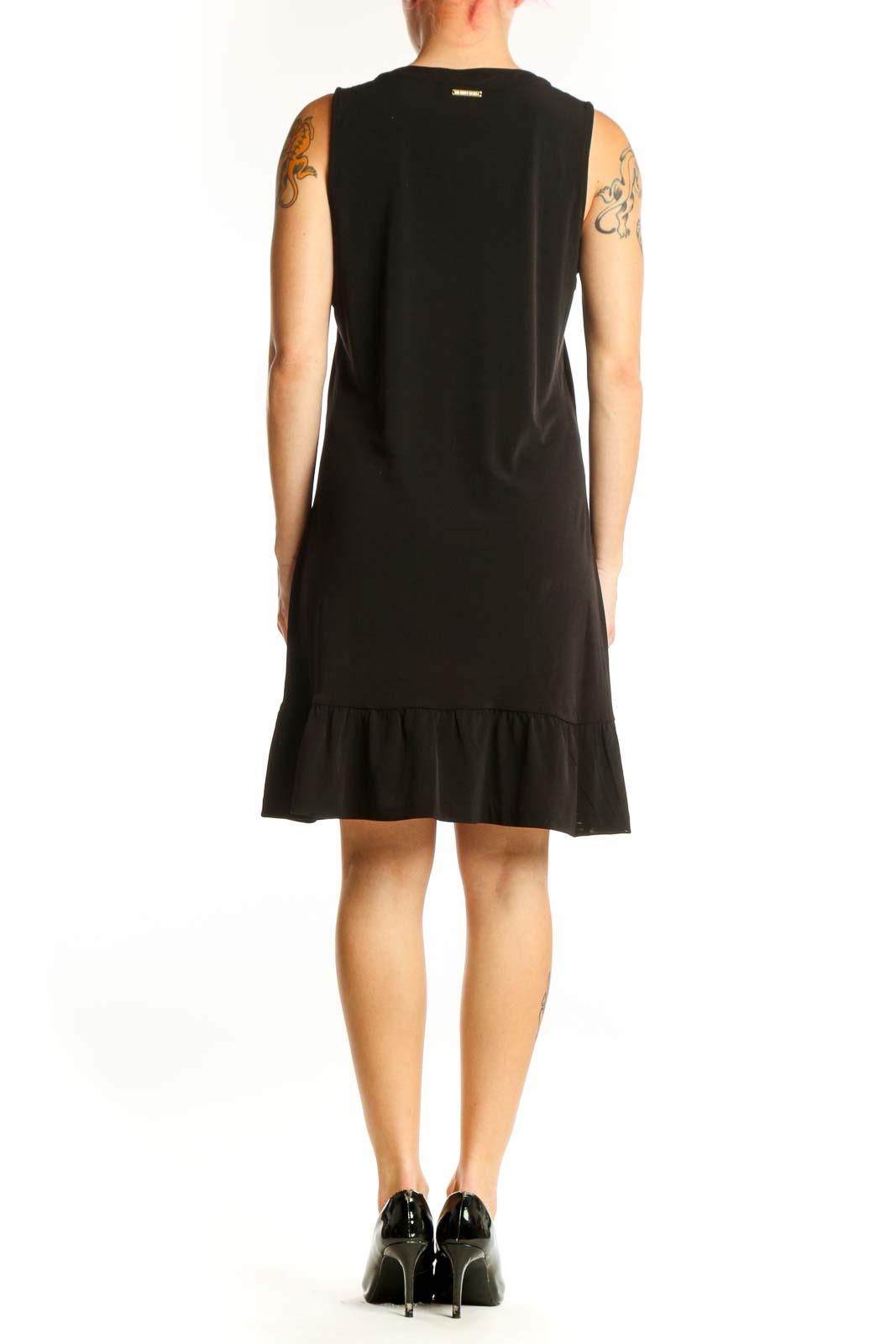 Black sleeveless shift dress with ruffle hem detail, back view