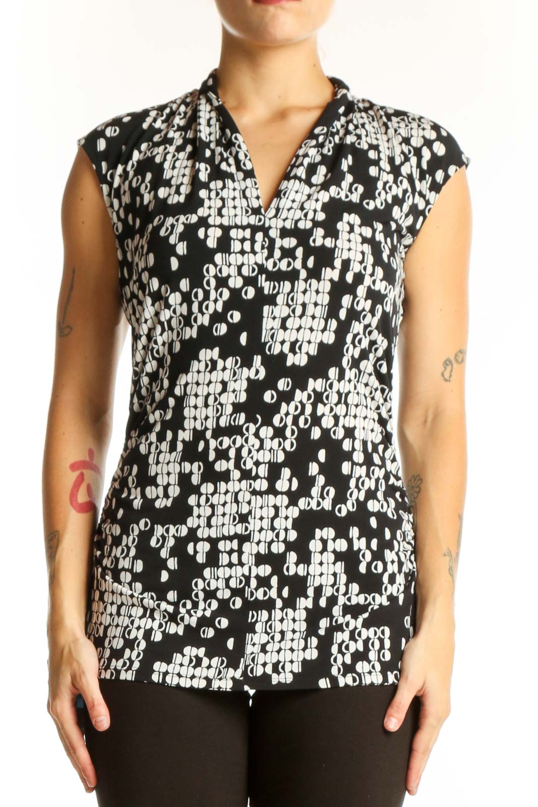 Front view of Vince Camuto black and white geometric print sleeveless top
