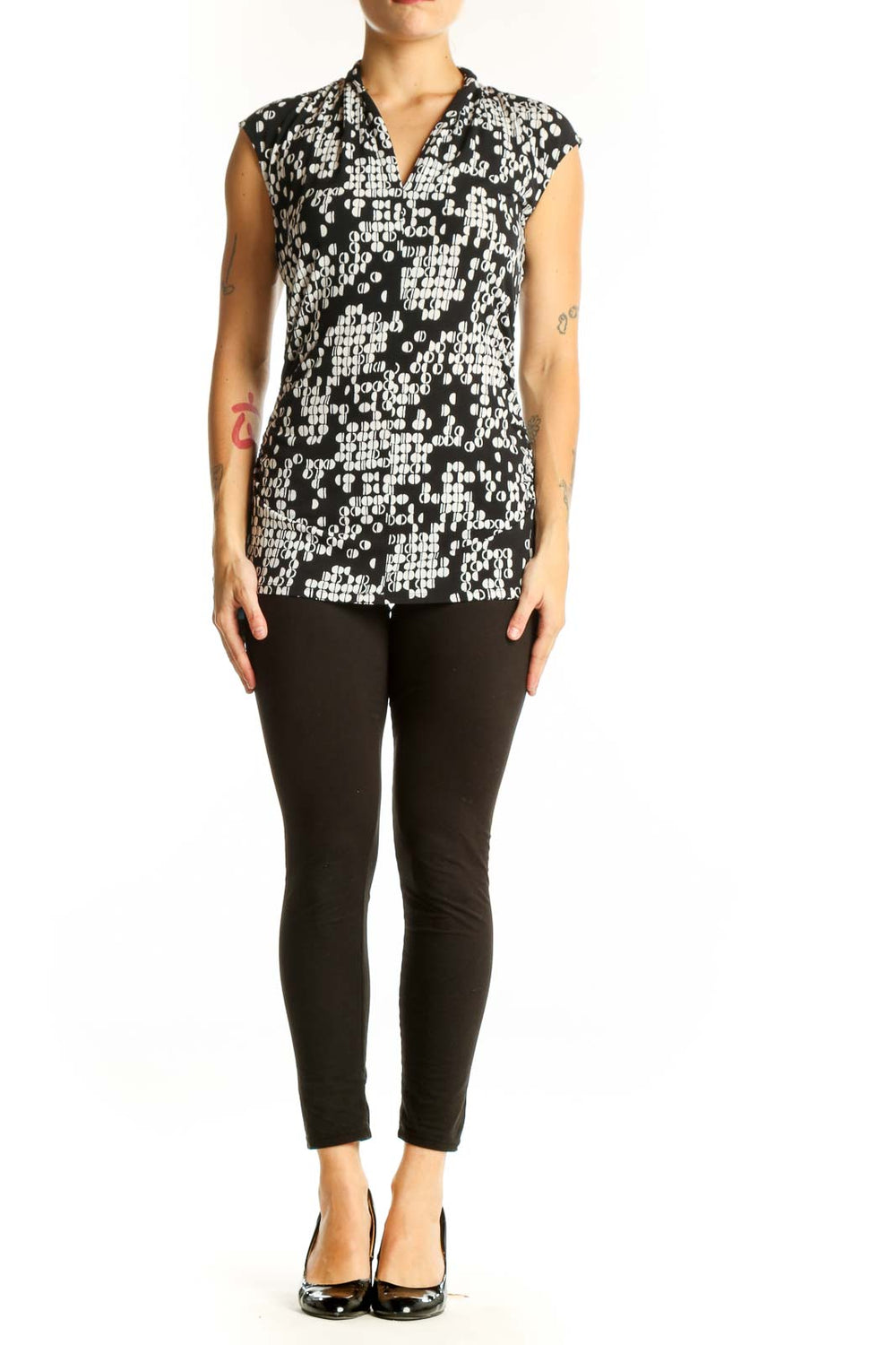 Front view of Vince Camuto black and white geometric print sleeveless top