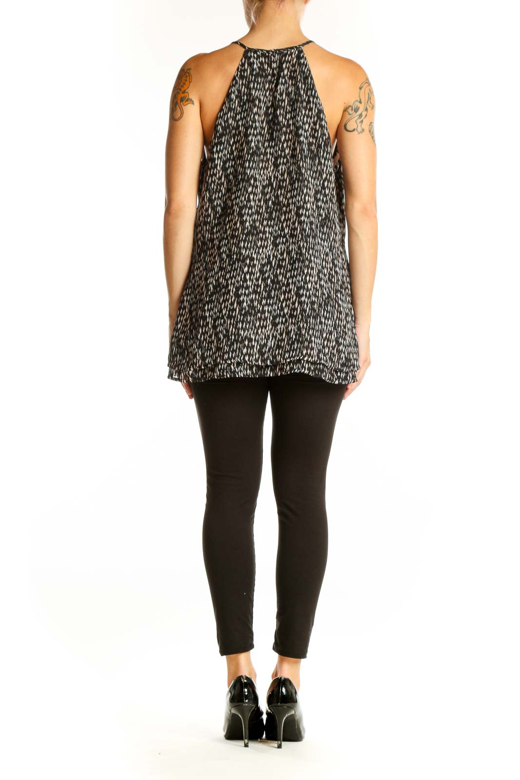 Side view of Banana Republic black patterned sleeveless blouse showing layered asymmetrical hem