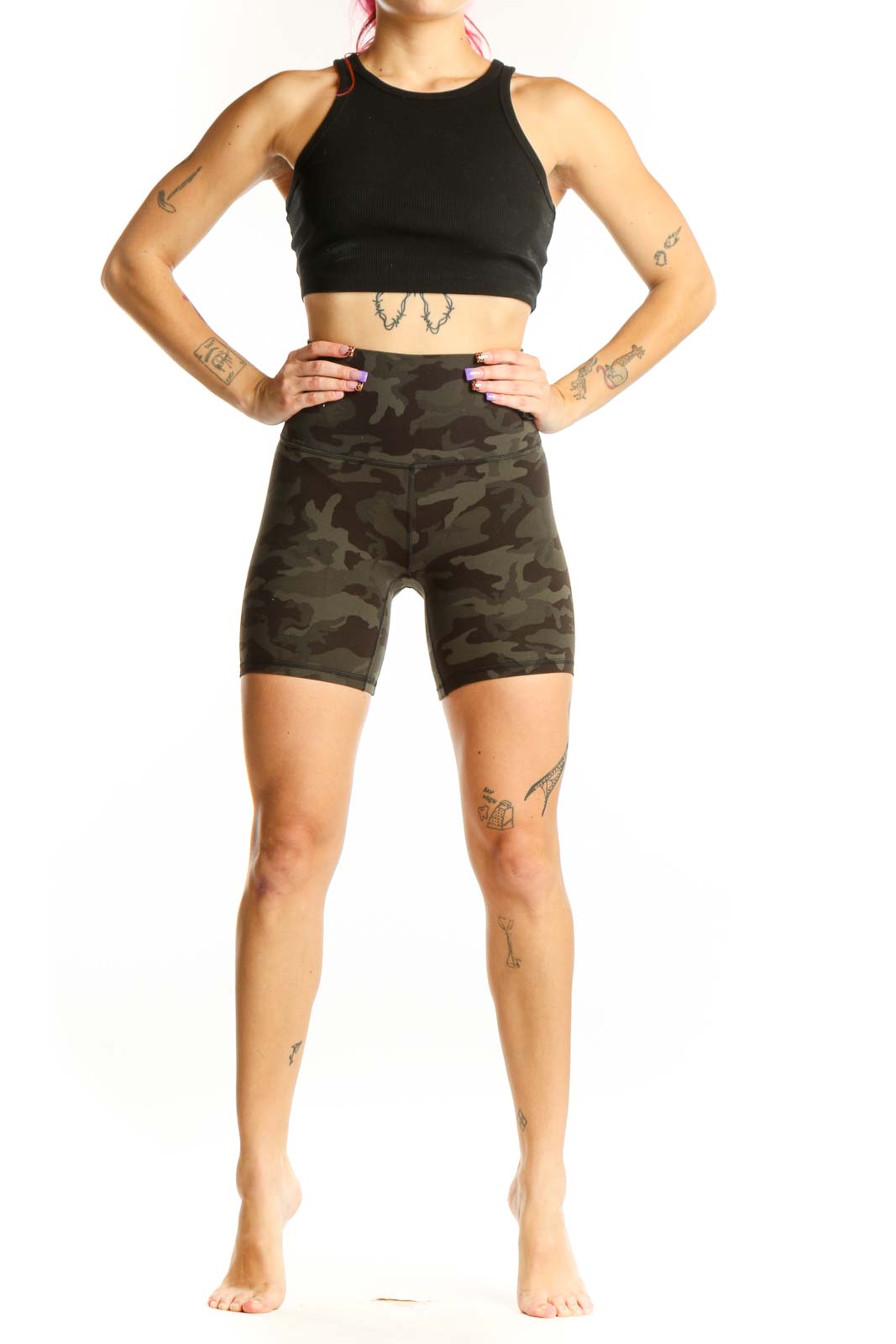 Front view of olive camo Lululemon bike shorts XS with high-waisted fitted design and camouflage pattern
