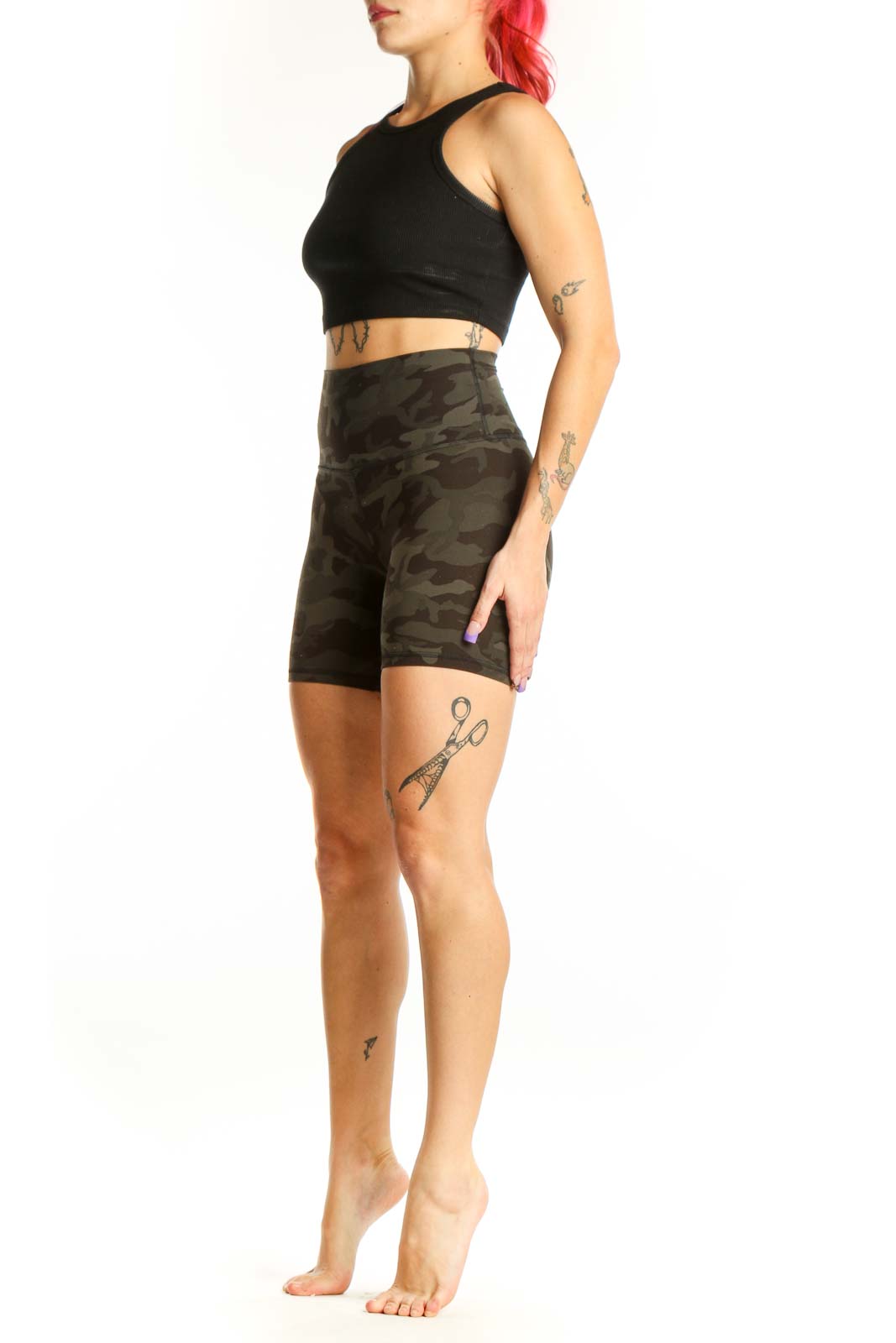 Front view of olive camo Lululemon bike shorts XS with high-waisted fitted design and camouflage pattern