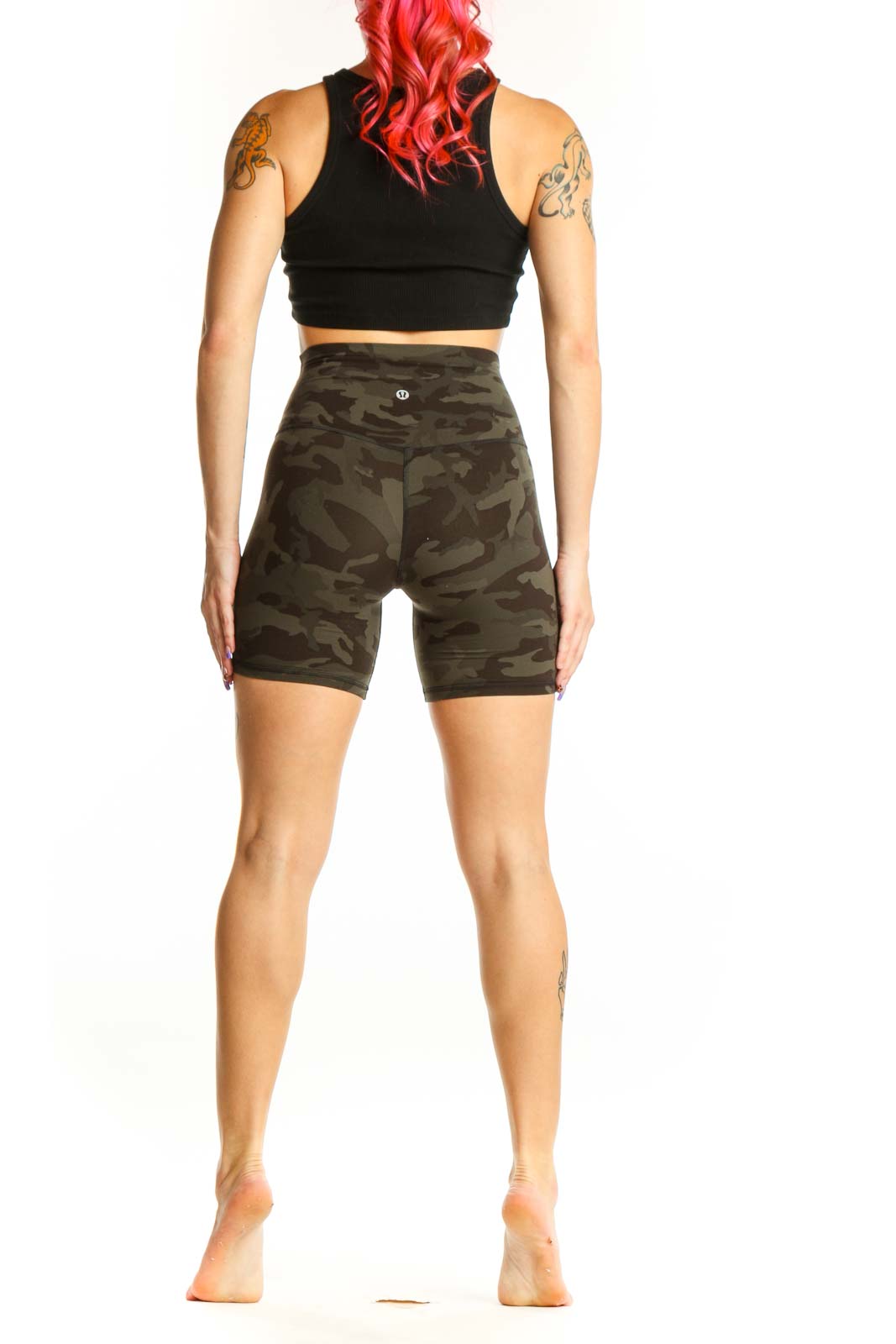 Back view of olive camo Lululemon bike shorts XS showing fitted silhouette and camouflage print detail
