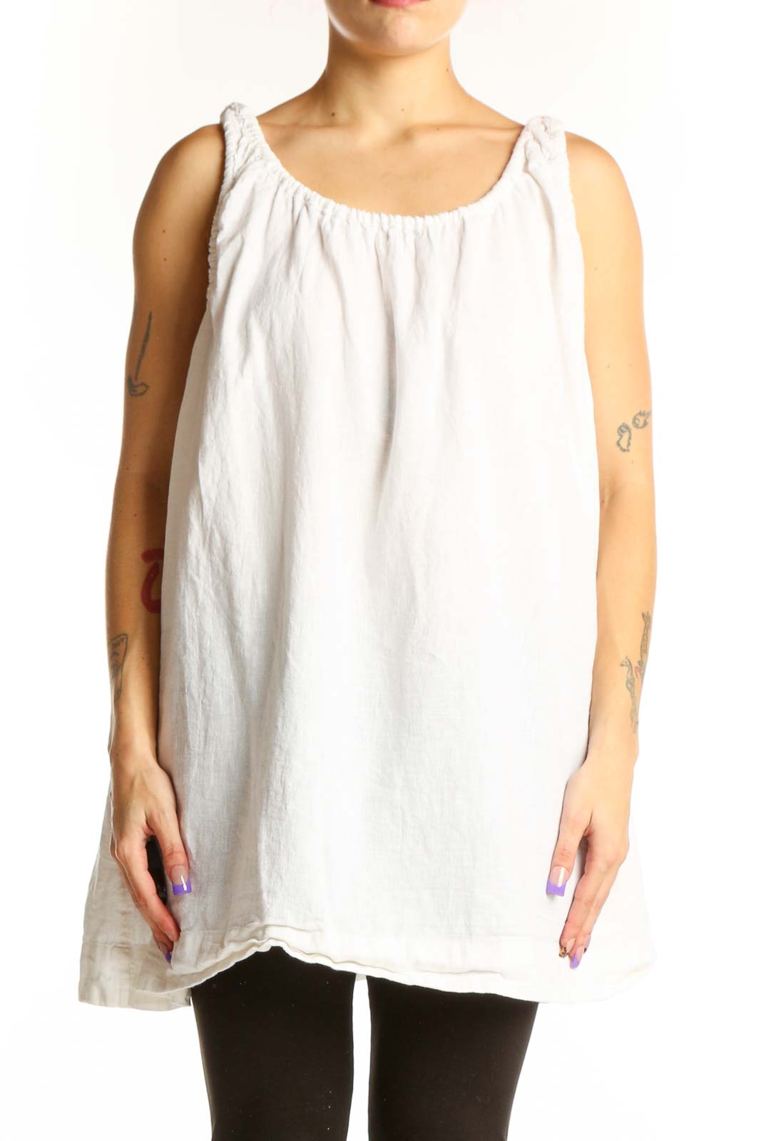 White linen cotton tank top with gathered neckline and shoulder ties, displayed on model from front