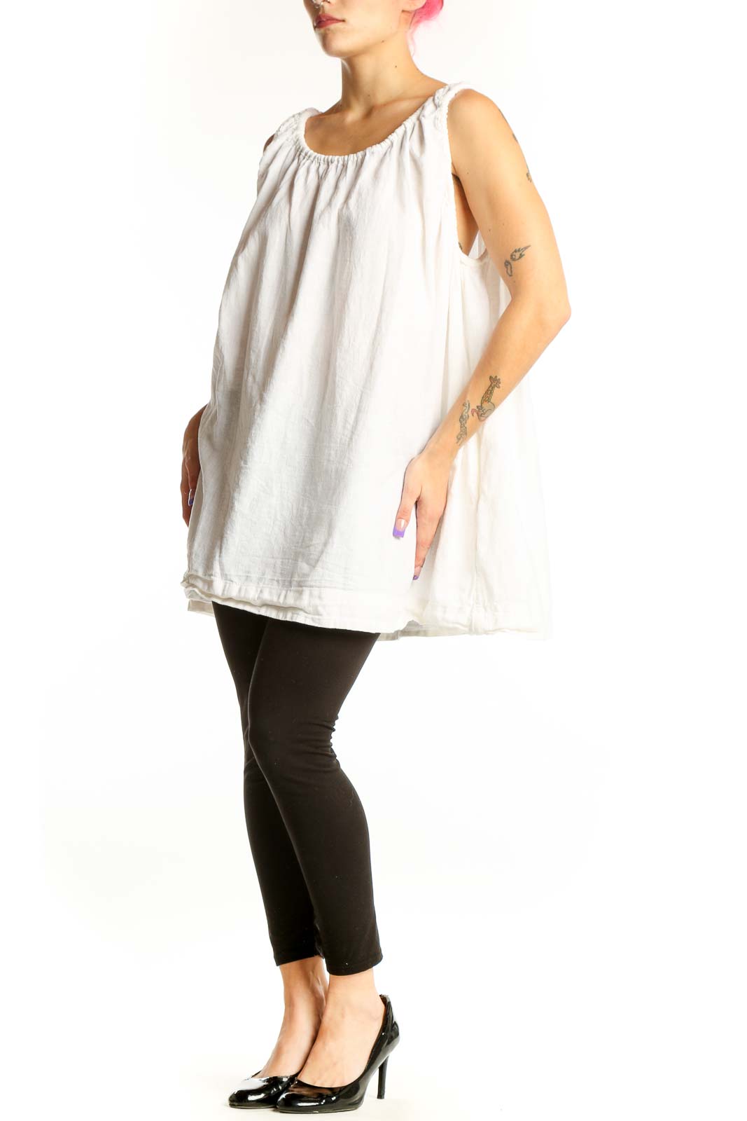 White linen cotton tank top with gathered neckline and shoulder ties, displayed on model from front