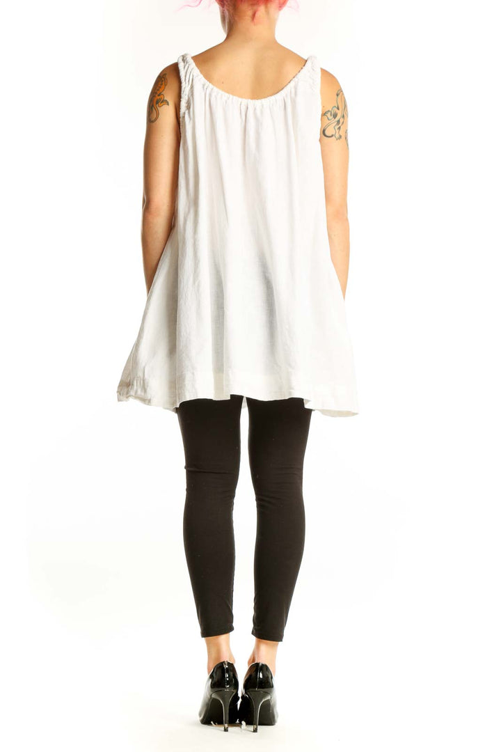 Back view of white sleeveless tank top showing relaxed A-line silhouette and gathered neckline detail