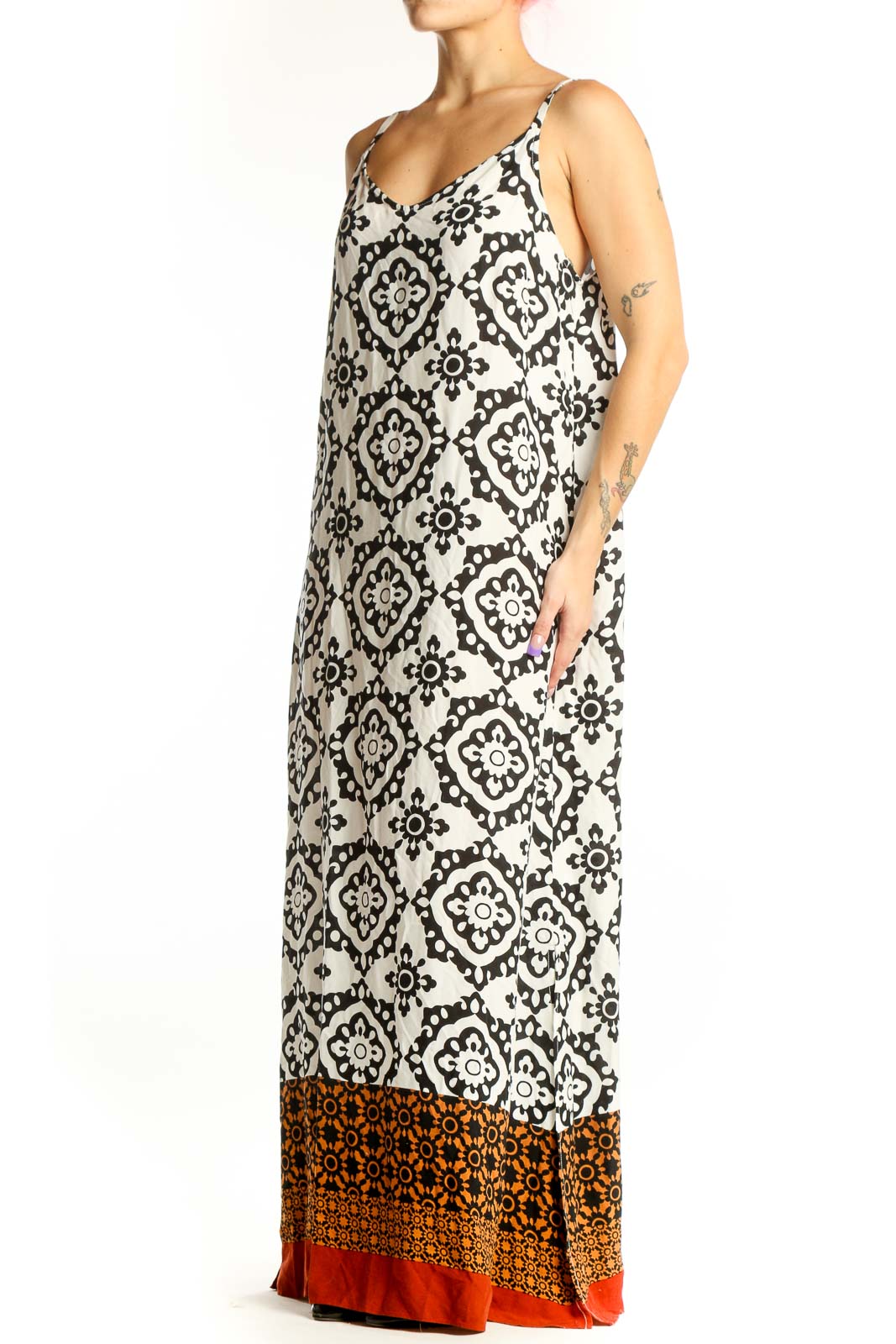 Cream and black geometric print Vince Camuto maxi dress with burnt orange and red color-block hem, front view