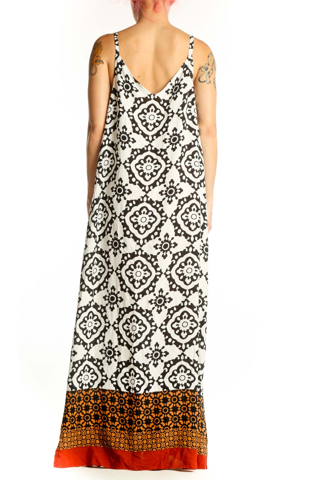 Cream and black geometric print Vince Camuto maxi dress with burnt orange and red color-block hem, back view