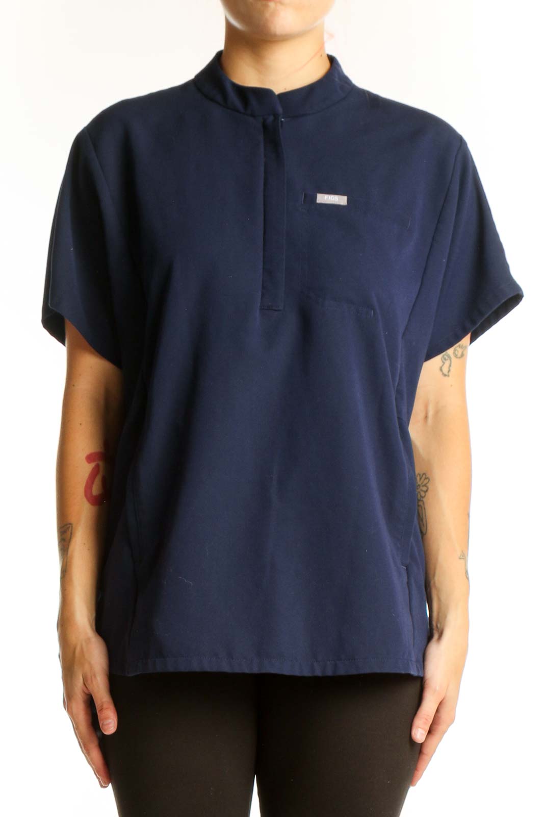 Front view of navy FIGS top with mandarin collar and half-zip
