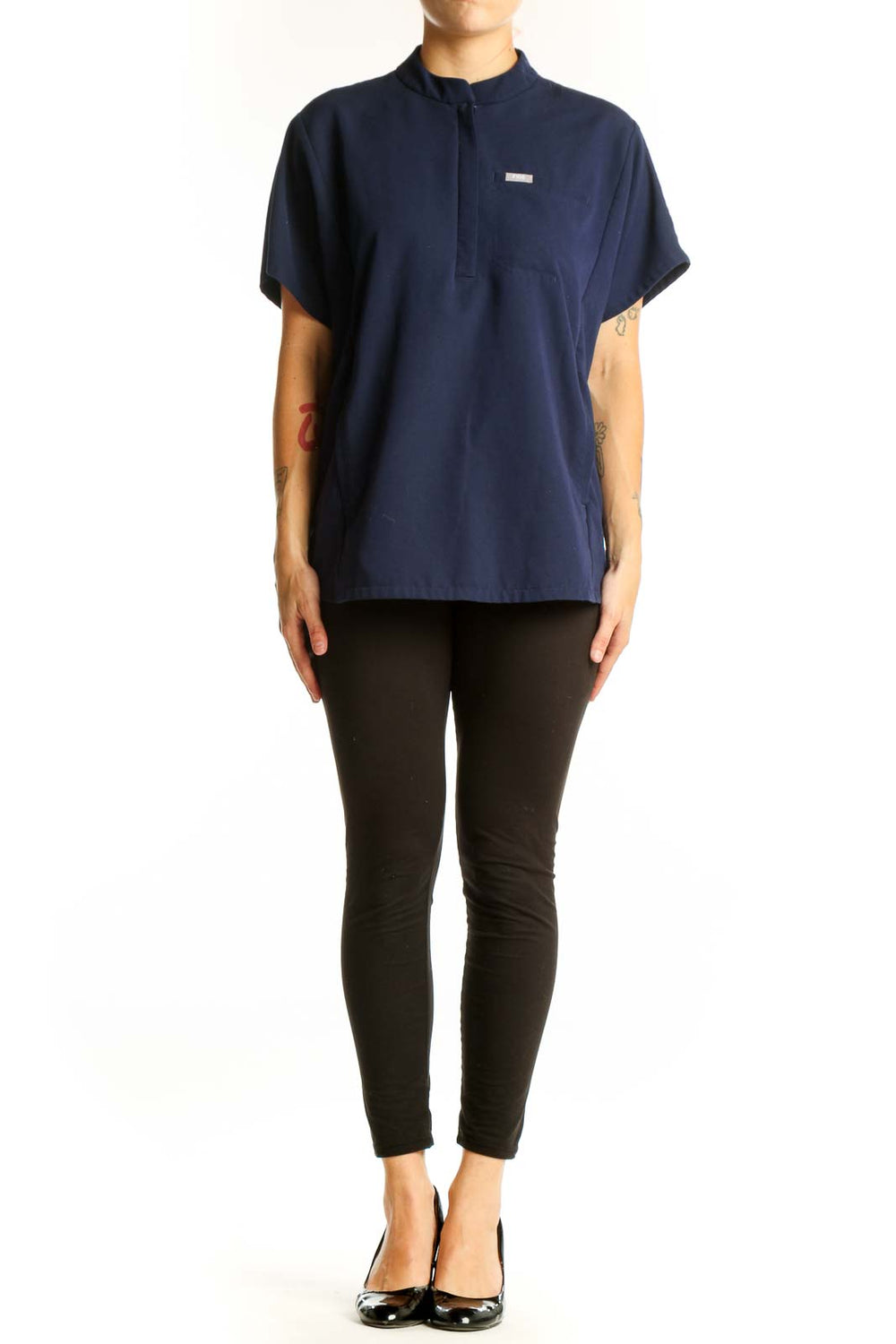 Front view of navy FIGS top with mandarin collar and half-zip