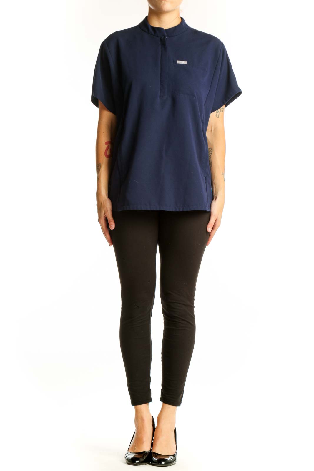 Front view of navy FIGS top with mandarin collar and half-zip
