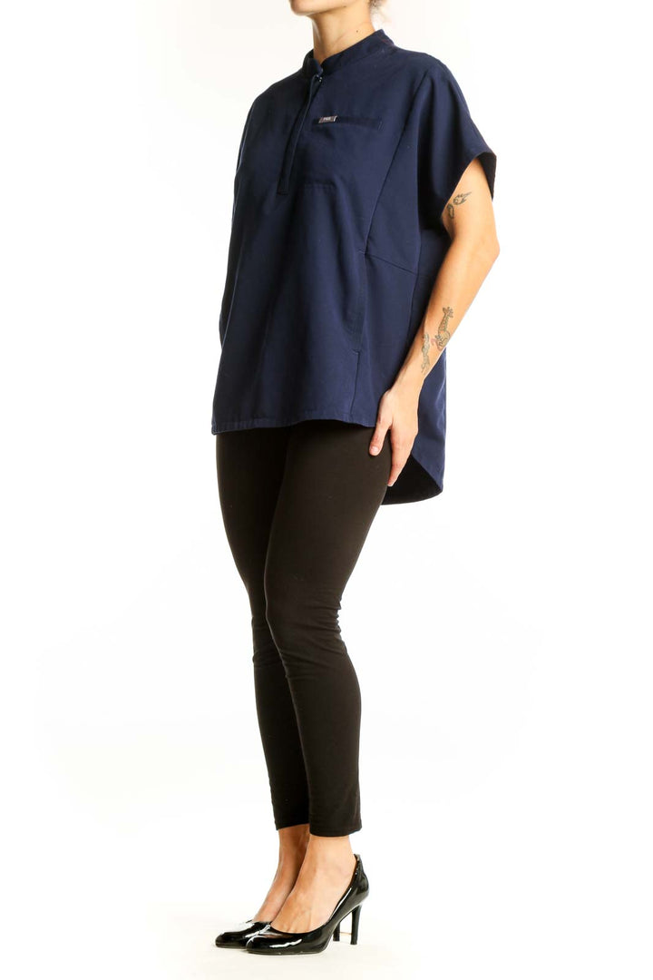 Front view of navy FIGS top with mandarin collar and half-zip