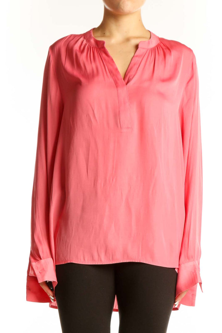 Front view of pink NYDJ long-sleeve polyester blouse with V-neckline