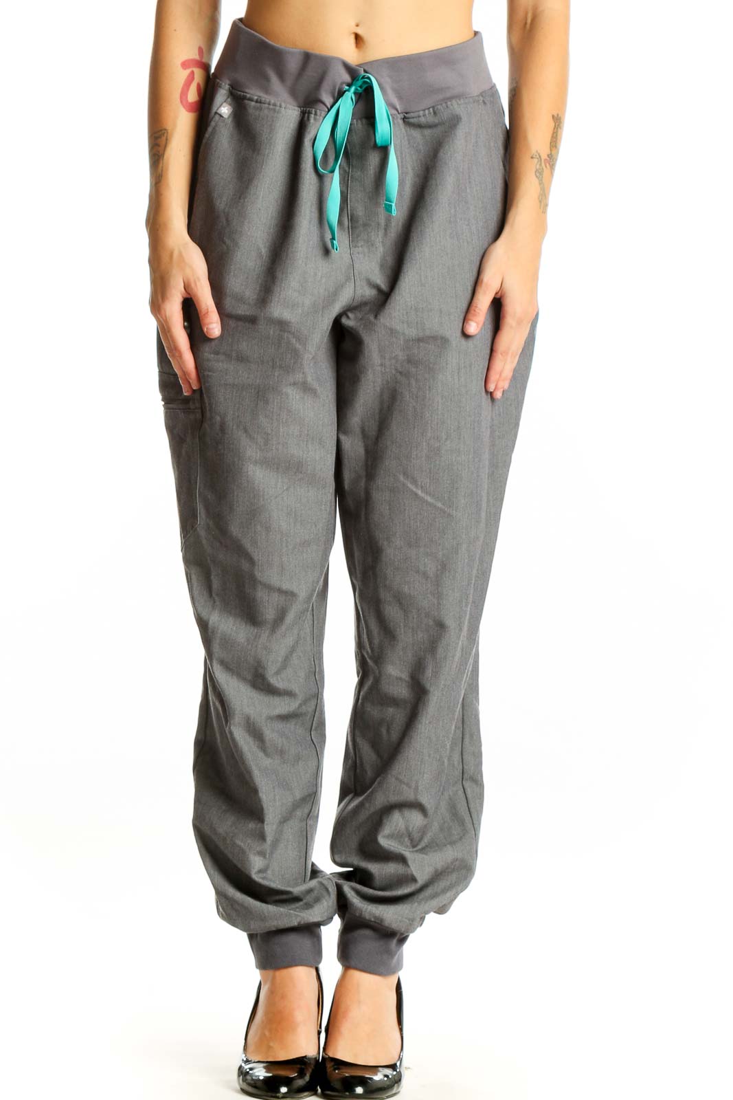 Front view of gray FIGS jogger pants with teal drawstring