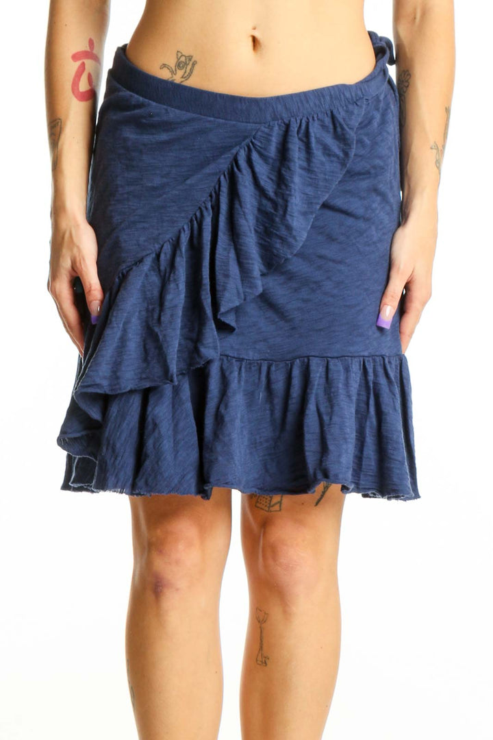 Navy ruffled cotton mini skirt with asymmetrical wrap-style front and tiered ruffle detail