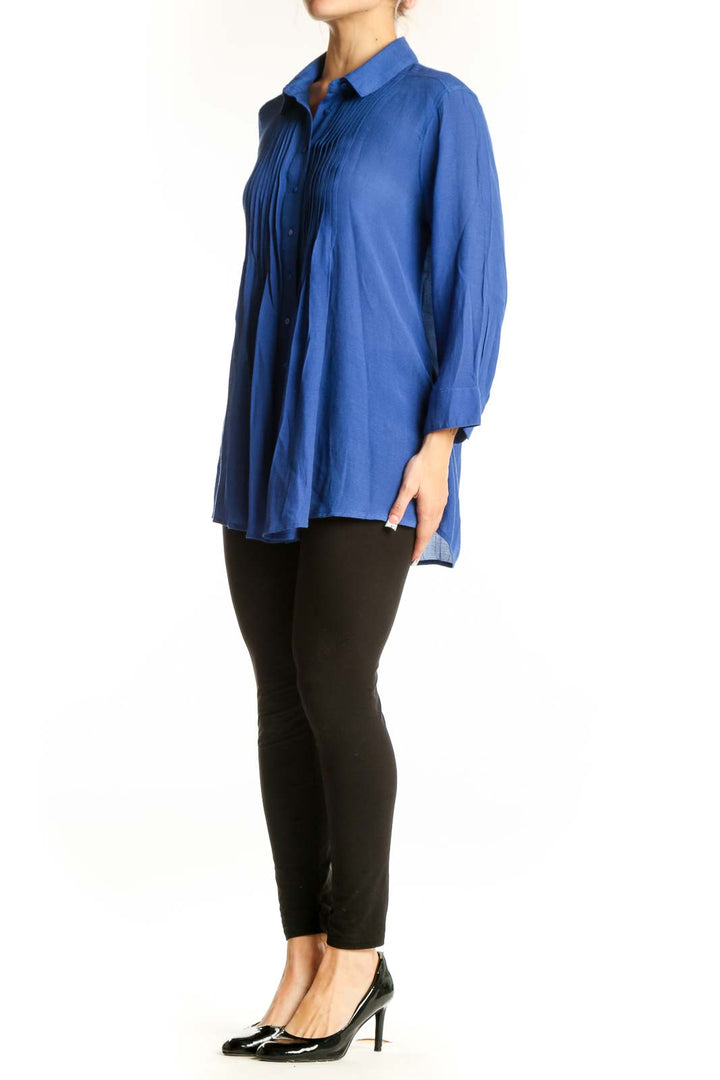 Front view of blue pleated button-down blouse by Fever