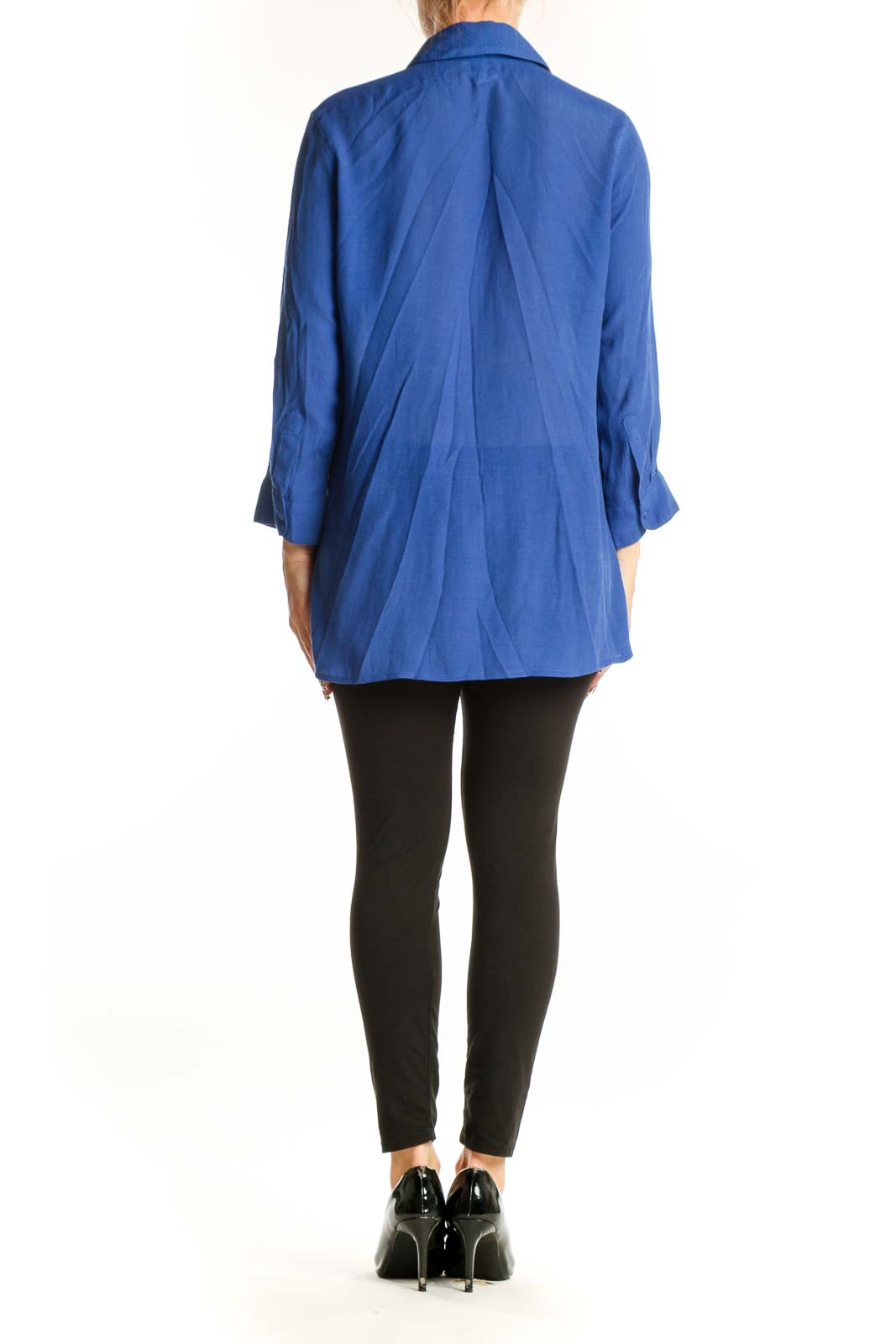 Side view of blue pleated button-down blouse by Fever on model