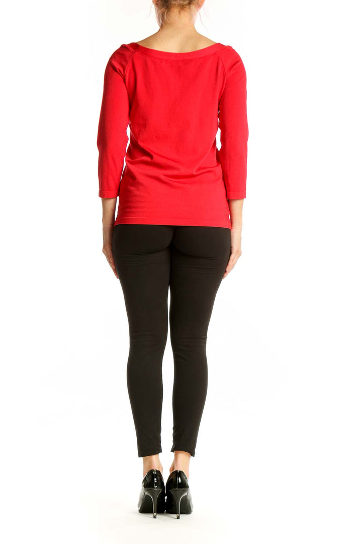 Red long sleeve cotton top with crew neckline, back view on model