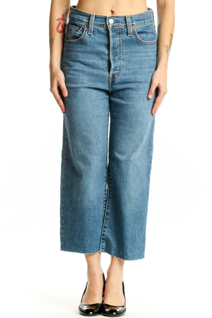 Front view of blue denim cropped wide-leg jeans with high waist and classic Levi's detailing