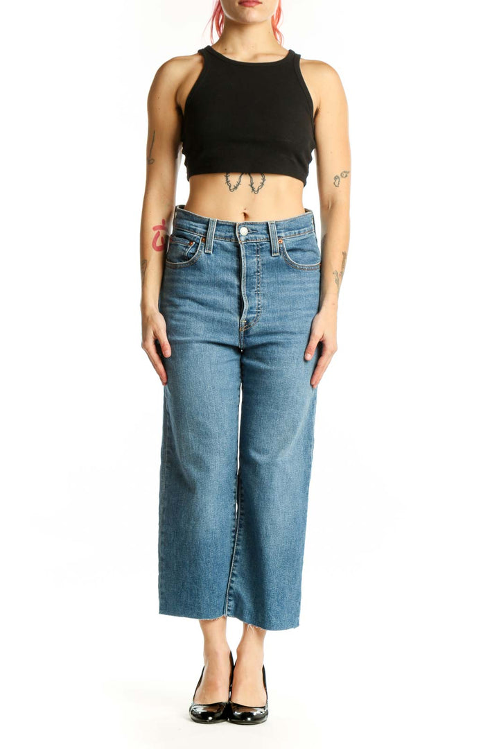 Front view of blue denim cropped wide-leg jeans with high waist and classic Levi's detailing