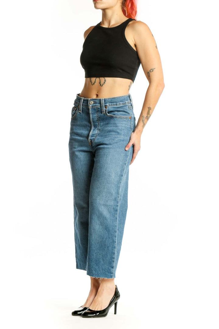 Front view of blue denim cropped wide-leg jeans with high waist and classic Levi's detailing